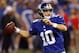 Aug 16, 2014; Indianapolis, IN, USA; New York Giants quarterback Eli Manning (10) throws a pass against the Indianapolis Colts in the first half at Lucas Oil Stadium. Mandatory Credit: Brian Spurlock-USA TODAY Sports