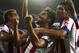 Atletico's Raul Garcia, center, celebrates his goal with his teammates during a Spanish Supercup first leg soccer match between Real Madrid and Atletico Madrid at Santiago Bernabeu stadium in Madrid, Spain, Tuesday, Aug. 19, 2014. (AP Photo/Andres Kudacki)