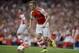 Arsenal's Calum Chambers controls the ball as he makes his debut during the Emirates Cup soccer match between Arsenal and Benfica at Arsenal's Emirates Stadium in London, Saturday, Aug. 2, 2014. (AP Photo/Matt Dunham)