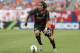 Liverpool FC midfielder Lazar Markovic (50) controls the ball against the Olympiacos during the first half of International Champions Cup soccer match in Chicago, Sunday, July 27, 2014. The Liverpool FC won 1-0. (AP Photo/Nam Y. Huh)