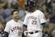 Houston Astros Jose Altuve (27) and Chris Carter (23) after scoring on Carter's 3-run homer against the Minnesota Twins in the fifth inning of a baseball game Tuesday, Aug. 12, 2014, in Houston. (AP Photo/Pat Sullivan)