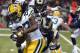 Aug 16, 2014; St. Louis, MO, USA; Green Bay Packers running back Eddie Lacy (27) runs the ball under pressure from St. Louis Rams outside linebacker Jo-Lonn Dunbar (58) during the first half at Edward Jones Dome. Mandatory Credit: Jasen Vinlove-USA TODAY Sports