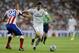 Real Madrid's James Rodriguez from Colombia, fights for the ball with Atletico Madrid's Joao Miranda from Brazil, left, during a Spanish Super Cup soccer match at Santiago Bernabeu stadium in Madrid, Spain, Tuesday, Aug. 19, 2014 . (AP Photo/Daniel Ochoa de Olza)