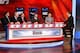 TORONTO, ON - APRIL 15: Broadcast host James Duthie (R) stands with team representatives attending the 2014 NHL Draft Lottery on April 15, 2014 at the TSN Studios in Toronto, Ontario. Seated, from left, are Trent Klatt, head amateur scout, New York Islanders; Brian Burke, president-hockey operations, Toronto Maple Leafs; Scott Howson, senior vice president-hockey operations, Edmonton Oilers; Travis Viola, vice president-hockey operations, Florida Panthers and Tim Murray, general manager, Buffalo Sabres. (Photo by Bill Wippert/NHLI via Getty Images)