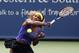 Serena Williams returns a volley to Caroline Wozniacki, from Denmark, during a semifinal match at the Western & Southern Open tennis tournament, Saturday, Aug. 16, 2014, in Mason, Ohio. Williams won 2-6, 6-2, 6-4. (AP Photo/David Kohl)