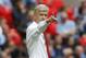 Arsenal's manager Arsene Wenger points as he watches his team play against Manchester City during their English Community Shield soccer match at Wembley Stadium in London, Sunday, Aug. 10, 2014. (AP Photo/Sang Tan)