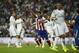 Atletico's Raul Garcia, center, celebrates his goal during a Spanish Supercup first leg soccer match between Real Madrid and Atletico Madrid at the Santiago Bernabeu stadium in Madrid, Spain, Tuesday, Aug. 19, 2014. (AP Photo/Andres Kudacki)