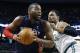Detroit Pistons' Greg Monroe, left, looks to shoot past Boston Celtics' Jared Sullinger, right, in the first quarter of an NBA basketball game in Boston, Sunday, March 9, 2014. (AP Photo/Michael Dwyer)