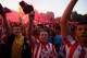 MADRID, SPAIN - MAY 17: Club Atletico de Madrid fans celebrate at Neptuno Square after winning the La Liga match against FC Barcelona on May 17, 2014 in Madrid, Spain. The FC Barcelona match against Club Atletico de Madrid will decide the Spanish league title at Camp Nou. This is the third time in the history of the Spanish league that the title will be decided between the first and second placed teams in the league,Êon the last game of the season. (Photo by Pablo Blazquez Dominguez/Getty Images)