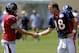 Houston Texans quarterback Ryan Fitzpatrick (14) and Denver Broncos quarterback Peyton Manning (18) shake hands following a joint practice between the Denver Broncos and the Houston Texans on Wednesday, Aug. 20, 2014, in Englewood, Colo. (AP Photo/Jack Dempsey)
