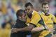 New Zealand All Black captain Richie McCaw left, and Australian Wallabies Kurtley Beale clash while chasing the ball during their Bledisloe Cup rugby test match against the in Sydney, Australia, Saturday, Aug. 16, 2014. The match was a draw at 12-12.(AP Photo/Rob Griffith)