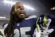 SEATTLE, WA - JANUARY 19: Cornerback Richard Sherman #25 of the Seattle Seahawks reacts on the sideline after tipping a pass which led to a Seahawks game-clinching interception late in the fourth quarter against the San Francisco 49ers during the 2014 NFC Championship at CenturyLink Field on January 19, 2014 in Seattle, Washington. (Photo by Otto Greule Jr/Getty Images)