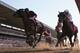 ELMONT, NY - JUNE 07: Tonalist #11 (L), ridden by Joel Rosario, races to the finish line enroute to winning the 146th running of the Belmont Stakes at Belmont Park on June 7, 2014 in Elmont, New York. (Photo by Rob Carr/Getty Images)