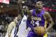 Memphis Grizzlies' Tony Allen (9) defends Los Angeles Lakers' Kobe Bryant (24) during the first half of an NBA basketball game in Memphis, Tenn., Tuesday, Dec. 17, 2013. (AP Photo/Danny Johnston)