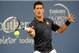 CINCINNATI, OH - AUGUST 12: Novak Djokovic of Serbia returns to Gilles Simon of France during a match on day 4 of the Western & Southern Open on August 12, 2014 in Cincinnati, Ohio. (Photo by Jonathan Moore/Getty Images)