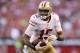 GLENDALE, AZ - DECEMBER 29: Wide receiver Michael Crabtree #15 of the San Francisco 49ers runs with the football after a reception against the Arizona Cardinals during the NFL game at the University of Phoenix Stadium on December 29, 2013 in Glendale, Arizona. The 49ers defeated the Cardinals 23-20. (Photo by Christian Petersen/Getty Images)
