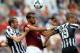 ROME, ITALY - MAY 11: Giorgio Chiellini(L) and Leonardo Bonucci of Juventus competes for the ball with Mehdi Benatia(C) of AS Roma during the Serie A match between AS Roma and Juventus at Stadio Olimpico on May 11, 2014 in Rome, Italy. (Photo by Paolo Bruno/Getty Images)