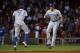 Toronto Blue Jays shortstop Jose Reyes (7) and center fielder Colby Rasmus celebrate after their 6-1 victory over the Boston Red Sox in a baseball game at Fenway Park in Boston, Wednesday, July 30, 2014. (AP Photo/Elise Amendola)
