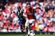 LONDON, ENGLAND - MAY 04: Mesut Ozil (R) of Arsenal holds off the challenge of Youssuf Mulumbu (L) of West Bromwich Albion during the Barclays Premier League match between Arsenal and West Bromwich Albion at the Emirates Stadium on May 4, 2014 in London, England. (Photo by Shaun Botterill/Getty Images)
