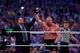 Paul Heyman, left, celebrates with Brock Lesnar after his win over the Undertaker during Wrestlemania XXX at the Mercedes-Benz Super Dome in New Orleans on Sunday, April 6, 2014. (Jonathan Bachman/AP Images for WWE)