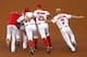 WASHINGTON, DC - AUGUST 21: Teammates mob Anthony Rendon #6 of the Washington Nationals after he knocked in the winning run against the Arizona Diamondbacks in the ninth inning at Nationals Park on August 21, 2014 in Washington, DC. The Nationals won the game 1-0, their tenth victory in a row. (Photo by Win McNamee/Getty Images)