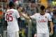 AC Milan's Stephan El Shaarawy, right, and teammate Mario Balotelli leave the field of play at the end of a Serie A soccer match against Atalanta in Bergamo, Italy, Sunday, May 11, 2014. Atalanta won 2-1. (AP Photo/Felice Calabro')