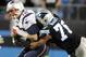 FILE - In this Nov. 18, 2013 file photo, New England Patriots' Tom Brady (12) is sacked by Carolina Panthers' Greg Hardy (76) during the first half of an NFL football game in Charlotte, N.C. A person familiar with the situation says defensive end Greg Hardy has signed his franchise tag tender with the Panthers. The person spoke to The Associated Press on condition of anonymity Tuesday because the signing has not been made official. (AP Photo/Mike McCarn, File)
