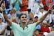 Roger Federer, from Switzerland, celebrates after defeating David Ferrer, from Spain, 6-3, 1-6, 6-2, in a final match at the Western and Southern Open tennis tournament, Sunday, Aug. 17, 2014, in Mason, Ohio. (AP Photo/Al Behrman)