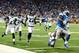 Aug 22, 2014; Detroit, MI, USA; Detroit Lions running back Reggie Bush (21) high steps away from Jacksonville Jaguars cornerback Alan Ball (23) to score a touchdown during the first quarter at Ford Field. Mandatory Credit: Andrew Weber-USA TODAY Sports