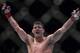 MACAU - AUGUST 23: Michael Bisping of England celebrates after winning his middleweight fight against Cung Le of USA during the UFC Fight Night at The Venetian Macao Cotai Arena on August 23, 2014 in Macau, China. (Photo by Victor Fraile/Getty Images)