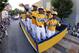 Members of the Jackie Robinson West Little League team from Chicago, Ill., ride in the Little League Grand Slam Parade as it makes its way through downtown Williamsport, Pa., Wednesday, Aug. 13, 2014. The Little League World Series tournament begins Thursday, August 14, in South Williamsport, Pa.. (AP Photo/Gene J. Puskar)