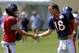 Houston Texans quarterback Ryan Fitzpatrick (14) and Denver Broncos quarterback Peyton Manning (18) shake hands following a joint practice between the Denver Broncos and the Houston Texans on Wednesday, Aug. 20, 2014, in Englewood, Colo. (AP Photo/Jack Dempsey)
