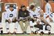 Cleveland Browns offensive coordinator Kyle Shanahan talks with quarterbacks Johnny Manziel (2) and Brian Hoyer (6) on the sidelines in the fourth quarter of a preseason NFL football game against the St. Louis Rams Saturday, Aug. 23, 2014, in Cleveland. (AP Photo/David Richard)
