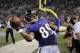 Baltimore Ravens wide receiver Steve Smith throws the ball into the stands after scoring a touchdown in the first half of an NFL preseason football game against the Washington Redskins, Saturday, Aug. 23, 2014, in Baltimore. (AP Photo/Nick Wass)