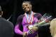 Simone Biles smiles after getting her gold medal at the gymnastics U.S. Championships, Saturday, Aug. 23, 2014, in Pittsburgh. Biles captured her second straight national title on Saturday night. (AP Photo/Keith Srakocic)