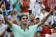 Roger Federer, from Switzerland, celebrates after defeating David Ferrer, from Spain, 6-3, 1-6, 6-2, in a final match at the Western and Southern Open tennis tournament, Sunday, Aug. 17, 2014, in Mason, Ohio. (AP Photo/Al Behrman)