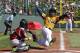 Chicago's Danon Radcliff, right, is tagged out attempting to score by Lynnwood, Washington catcher Robley Corsi III during the first inning of a Little League baseball game in United States pool play at the Little League World Series tournament in South Williamsport, Pa., Thursday, Aug. 14, 2014. Chicago won 12-2. (AP Photo/Gene J. Puskar)