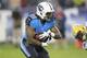 Tennessee Titans running back Bishop Sankey (20) runs the ball in the third quarter of a preseason NFL football game against the Green Bay Packers Saturday, Aug. 9, 2014, in Nashville, Tenn. (AP Photo/Wade Payne)