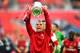 LONDON, ENGLAND - MAY 17: Lukas Podolski of Arsenal celebrates victory with the trophy after the FA Cup with Budweiser Final match between Arsenal and Hull City at Wembley Stadium on May 17, 2014 in London, England. (Photo by Shaun Botterill/Getty Images)
