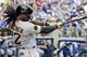 Pittsburgh Pirates' Andrew McCutchen hits a home run during the ninth inning of a baseball game against the Milwaukee Brewers, Sunday, Aug. 24, 2014, in Milwaukee. (AP Photo/Morry Gash)