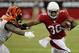Arizona Cardinals running back Andre Ellington (38) stiff arms Cincinnati Bengals defensive end Wallace Gilberry during the first half of an NFL preseason football game, Sunday, Aug. 24, 2014, in Glendale, Ariz. (AP Photo/Ross D. Franklin)