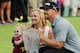 PARAMUS, NJ - AUGUST 24: Hunter Mahan celebrates with his wife Kandi, daughter Zoe and the tournament trophy after winning of The Barclays at The Ridgewood Country Club on August 24, 2014 in Paramus, New Jersey. (Photo by Hunter Martin/Getty Images)