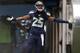 Seattle Seahawks cornerback Richard Sherman runs out of the tunnel before a preseason NFL football game against the San Diego Chargers, Friday, Aug. 15, 2014, in Seattle. (AP Photo/John Froschauer)