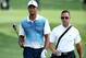 LOUISVILLE, KY - AUGUST 06: Tiger Woods (L) of the United States walks with golf instructor Sean Foley (R) during a practice round prior to the start of the 96th PGA Championship at Valhalla Golf Club on August 6, 2014 in Louisville, Kentucky. (Photo by Andy Lyons/Getty Images)