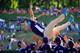 SOUTH WILLIAMSPORT, PA - AUGUST 24: Members of Team Asia-Pacific (L) throw an assistant coach in the air following their 8-4 win over the Great Lakes Team from Chicago, Illinois to win the Little League World Series Championship game at Lamade Stadium on August 24, 2014 in South Williamsport, Pennsylvania. (Photo by Rob Carr/Getty Images)
