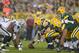 Aug 22, 2014; Green Bay, WI, USA; General view of the line of scrimmage as Green Bay Packers center Corey Linsley (63) snaps the ball to quarterback Matt Flynn (10) against the Oakland Raiders at Lambeau Field. Mandatory Credit: Kirby Lee-USA TODAY Sports