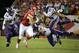 Kansas City Chiefs tight end Travis Kelce (87) runs from Minnesota Vikings safety Kurt Coleman (20), linebacker Jasper Brinkley (54) and safety Andrew Sendejo (34) during the second half of an NFL preseason football game in Kansas City, Mo., Saturday, Aug. 23, 2014. The Vikings won 30-12. (AP Photo/Charlie Riedel)