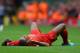 LIVERPOOL, ENGLAND - SEPTEMBER 01: Glen Johnson of Liverpool lies injured during the Barclays Premier League match between Liverpool and Manchester United at Anfield on September 01, 2013 in Liverpool, England. (Photo by Alex Livesey/Getty Images)