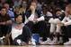 U.S. guard Derrick Rose, left, sits on the floor, next to forward Mason Plumlee and other teammates sitting on the bench during the second half of an exhibition basketball game at Madison Square Garden in New York, Wednesday, Aug. 20, 2014. Rose didn't play as the United States defeated the Dominican Republic 105-62. (AP Photo/Kathy Willens)