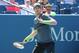 Aug 25, 2014; New York, NY, USA; Andy Murray (GBR) returns a shot to Robin Hasse (NED) on Armstrong Stadium on day one of the 2014 U.S. Open tennis tournament at USTA Billie Jean King National Tennis Center. Mandatory Credit: Anthony Gruppuso-USA TODAY Sports